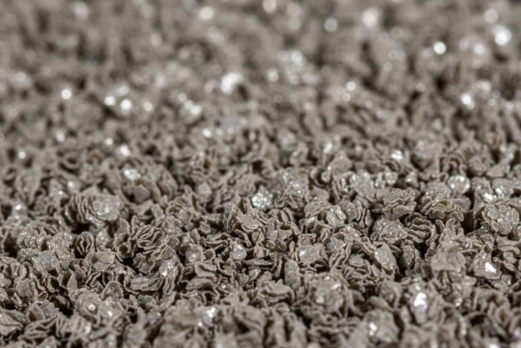 Vermiculite attic insulation granules (may contain asbestos; do not disturb)
